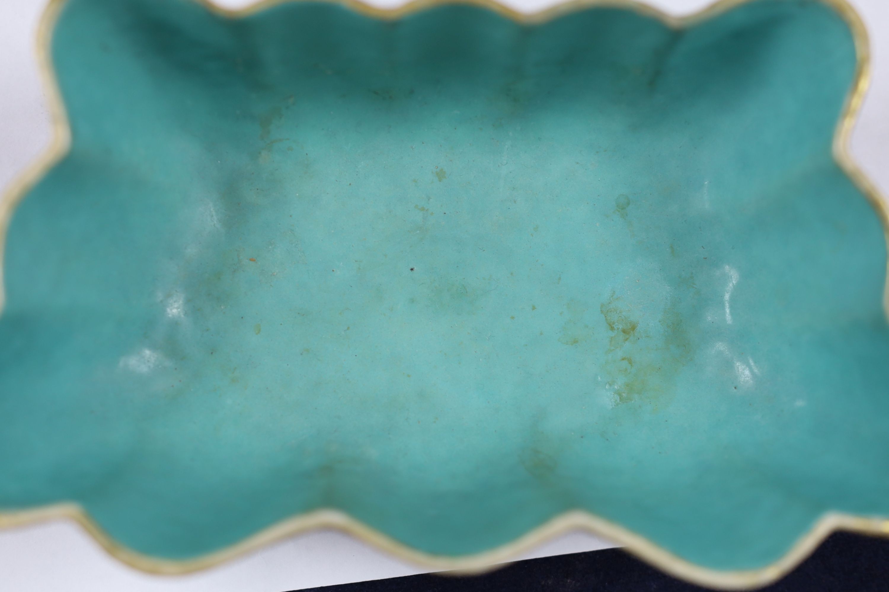 A Chinese enamelled porcelain ‘butterfly’ dish, 19th century, ground off reign mark, 19 cms wide at the front.